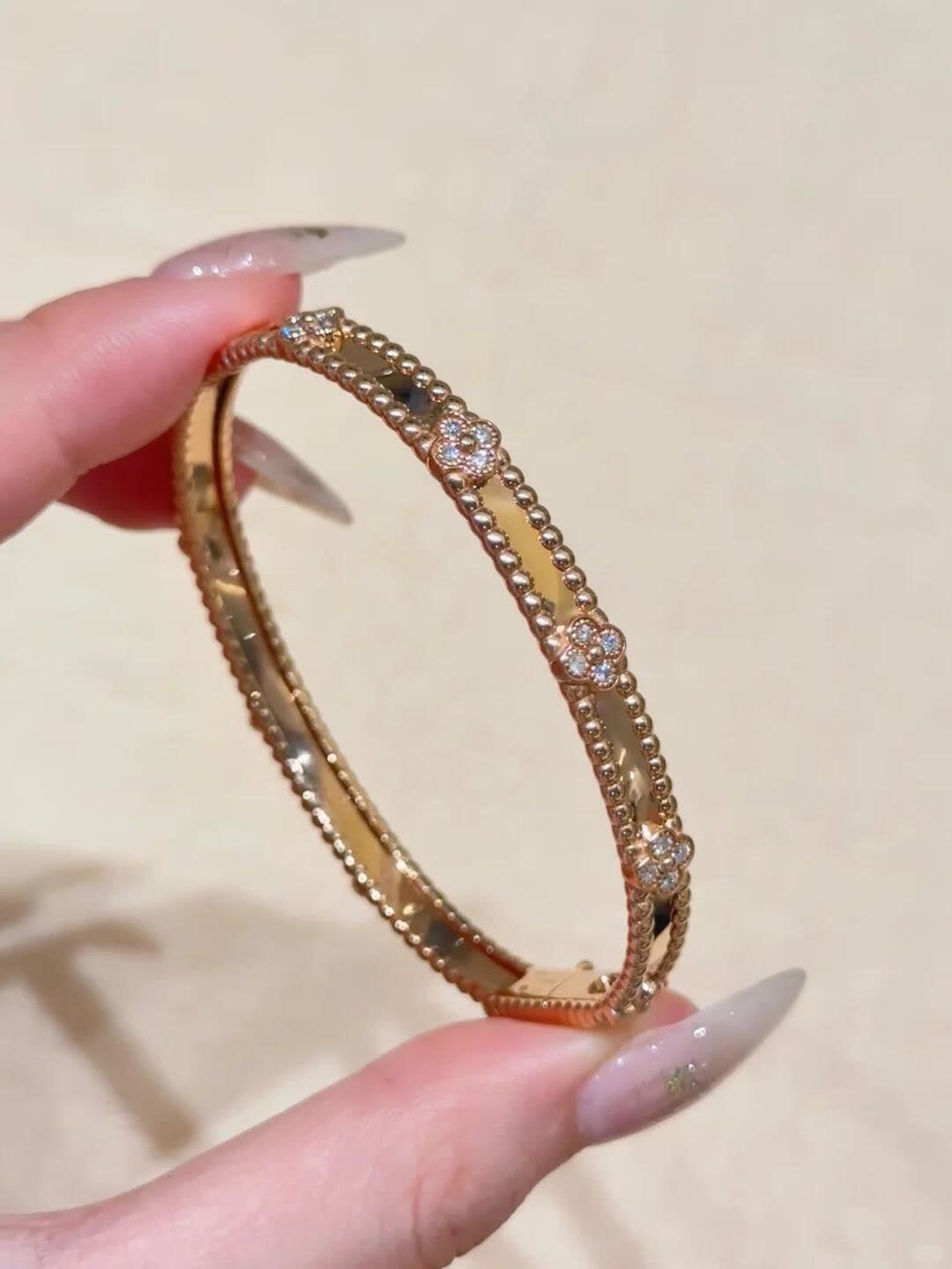 Van Cleef & Arpels Elegant Gold and Silver Bracelets Set